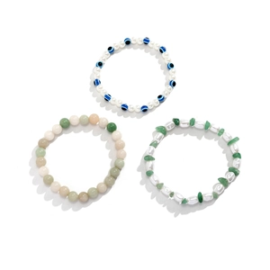 Three-piece layered bracelet set featuring evil eye beads, turquoise, and baroque pearls