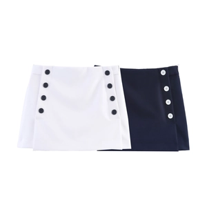 Close-up of A-line mini skirts in white and navy with double-breasted button details