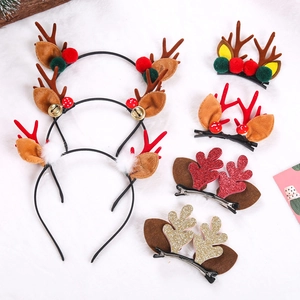 Christmas reindeer antler headbands and clips with sequins and plush on white background