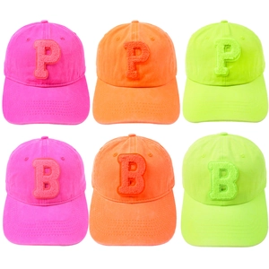 Neon fluorescent baseball caps with P and B chenille patches in pink, orange and green