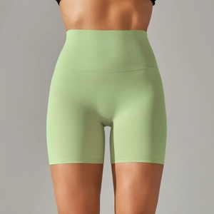 Close-up of light green high-waisted yoga shorts with seamless stitching and soft texture