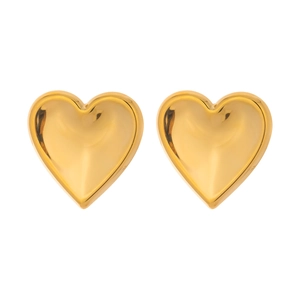 Detailed view of polished 18K gold heart-shaped stud earrings with reflective surface