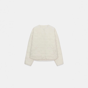 Women's wave quilted lightweight jacket with round neck and button closure in beige color