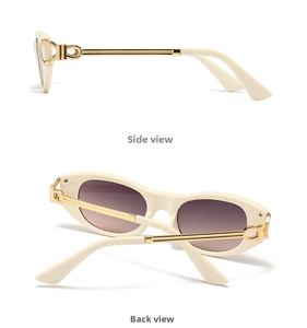 Detail view of oval sunglasses featuring cream frame and golden metallic Gancini style temples