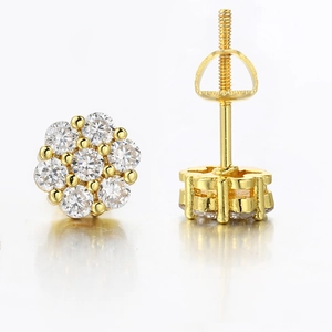 Detail of gold flower earrings with micro-set diamonds and secure screw back closure