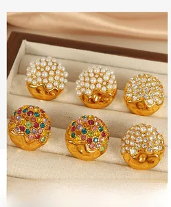 Detail of 6-piece earring set featuring pearls and rhinestones in a velvet jewelry box