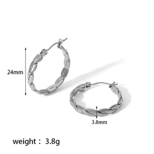 Detail view of silver twisted C-hoop earrings with 24mm diameter and 3.8mm width
