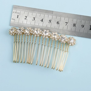 Detail showing bridal rhinestone sunflower hair comb dimensions with a metal ruler