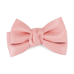 Detailed view of pink PU leather bow hair clip texture and elegant craftsmanship