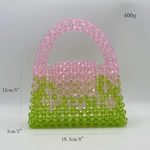 Detail view of pink and green beaded handbag with dimensions 19.5x12x5cm and 400g weight