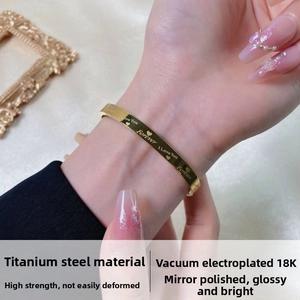 Detail showing 18K gold-plated titanium steel bracelet with I Love You engraving