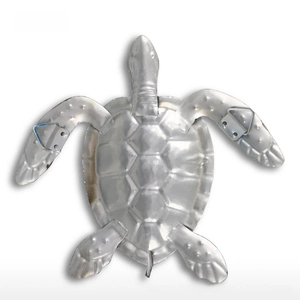 Detailed back view of metal sea turtle wall decor showing hanging hooks and texture