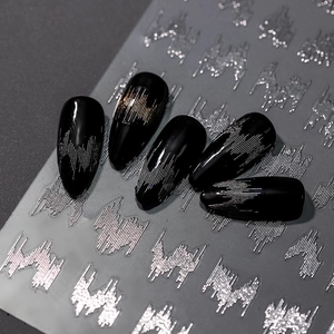 Silver wavy nail stickers with metallic laser effect on glossy black nails