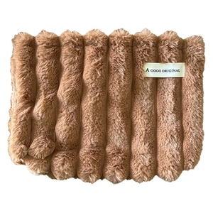 Brown plush ribbed neck warmer with a minimalist beige fabric label on white background