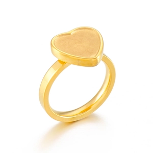 Polished gold heart-shaped ring base with 45-degree view on white background