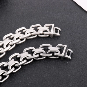 Macro shot of vintage style stainless steel curb chain links for men with aged silver finish