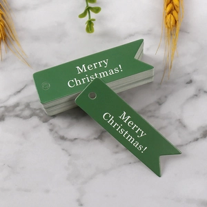 Dettagli delle etichette regalo di Natale verdi con scritta bianca Merry Christmas