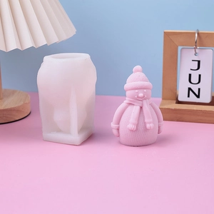 Silicone snowman candle mold for DIY crafts with pink scarf snowman final product