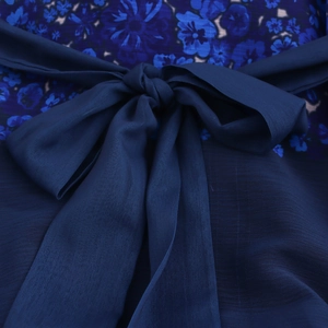 Elegant navy blue floral chiffon dress featuring a waist bow tie and lightweight fabric