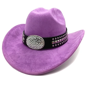 Detail of purple faux suede cowboy hat with studded leather band and rhinestone buckle