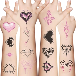 Detail showing Y2K temporary tattoos with heart and butterfly designs on skin
