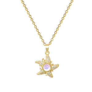 Elegant gold starfish pendant necklace with sparkling crystals and iridescent gemstone