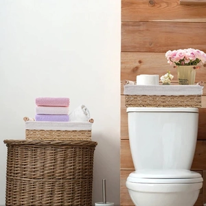 Detail of woven paper rope storage basket with beige cloth lining for bathroom decor