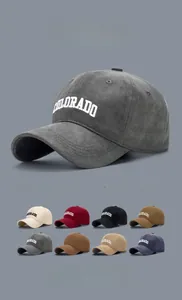 Detail view of cotton twill baseball caps showing diverse colors and Colorado embroidery