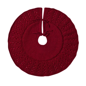 Knitted red Christmas tree skirt with round braided pattern and tie-up closure design