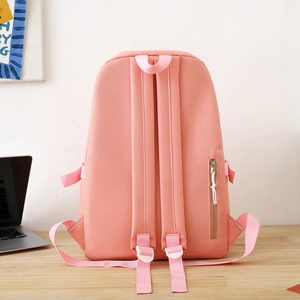 Rear view of pink nylon backpack showing adjustable straps and hidden back zipper pocket