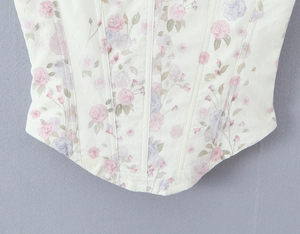 Macro view of floral lace pattern with mesh overlay and vintage corsetry boning detail