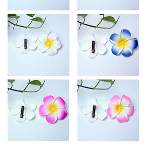 Detailed four-grid view of colorful foam plumeria hair clips with elegant pearl centers