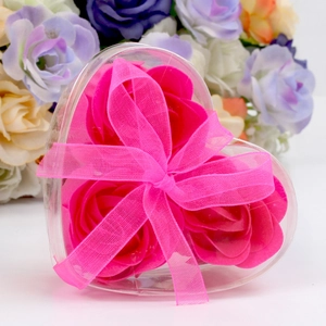 Close-up of pink heart-shaped soap flower gift box with elegant satin ribbon bow