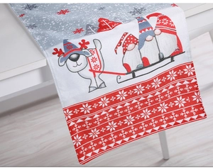 Detail of Christmas table runner fabric texture with gnome and snowflake patterns