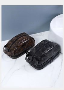 Beauty case in pelle vintage marrone e nera con doppia cerniera e maniglia laterale