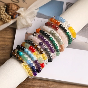 8mm natural stone bead bracelets with tiger eye and agate displayed on a rustic wood surface