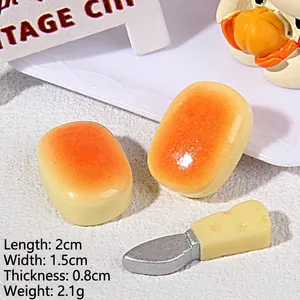 Detailed macro view of 2cm miniature resin bread and cheese knife for DIY crafts