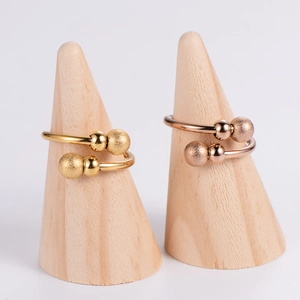 Adjustable dual-bead rings in gold and rose gold with polished and frosted finishes