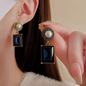 Vintage gold earrings with large blue square crystal, pearls, and light blue stones