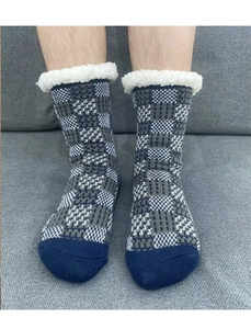 Detail of men's blue plaid knitted thermal socks with white sherpa lining and cozy finish