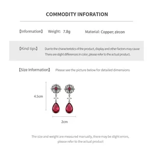 Size details of vintage hollow flower earrings featuring copper and red zircon stones