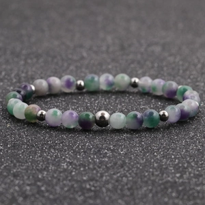 Close-up of 6mm mixed tiger eye and agate beaded bracelet with silver metal spacers