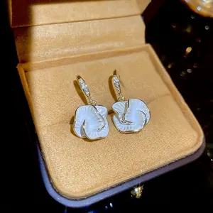 French camellia flower drop earrings with white enamel petals and gold zircon hooks