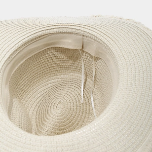 Detail of raffia sun hat interior showing the sweatband and adjustable drawstring