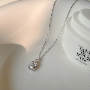 Detailed macro shot of an S925 silver necklace with rectangular zircon pendant