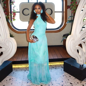 Elegant light blue halter neck maxi dress with a subtle marble print and sheer fabric
