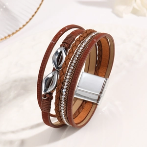 Detail view of multilayer brown leather bracelet with rhinestones and magnetic buckle