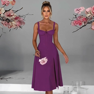 Detail of purple corset style dress featuring tie-up waist and side slit design