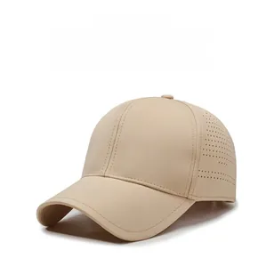 Detail of beige quick-dry baseball cap featuring breathable laser-cut side perforations