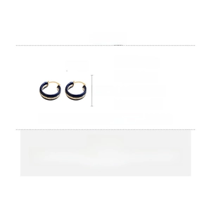 Detail view of deep blue enamel earrings with gold trim, size 2.2cm in copper material
